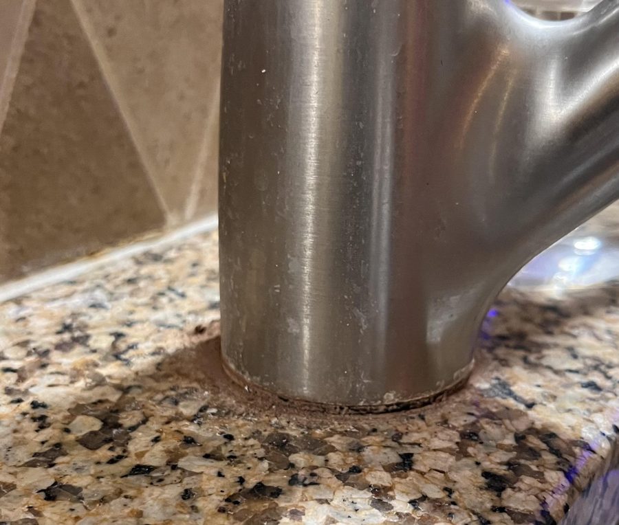 Faucet with hard water before cleaning